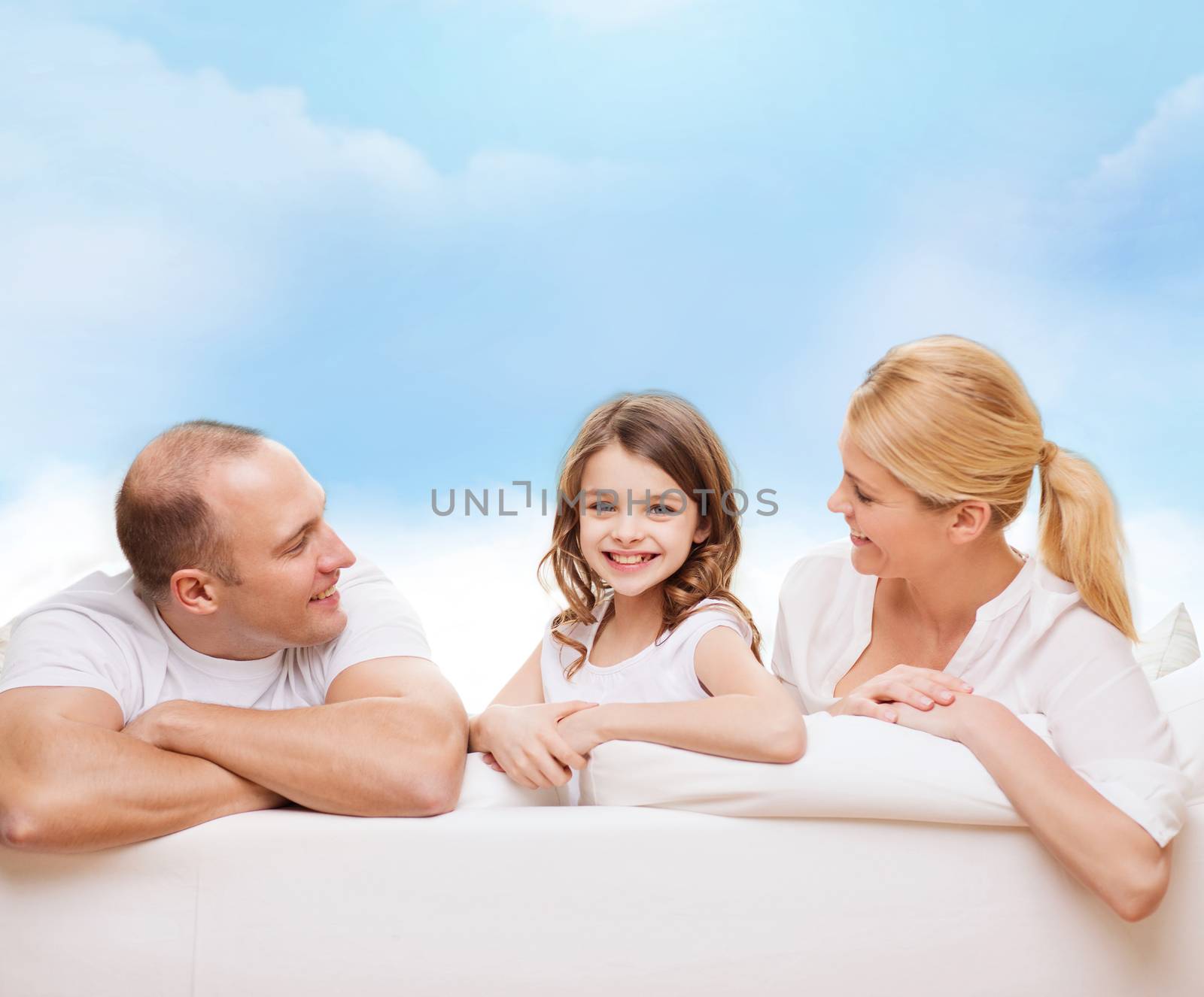 family, childhood and people - smiling mother, father and little girl over blue sky background