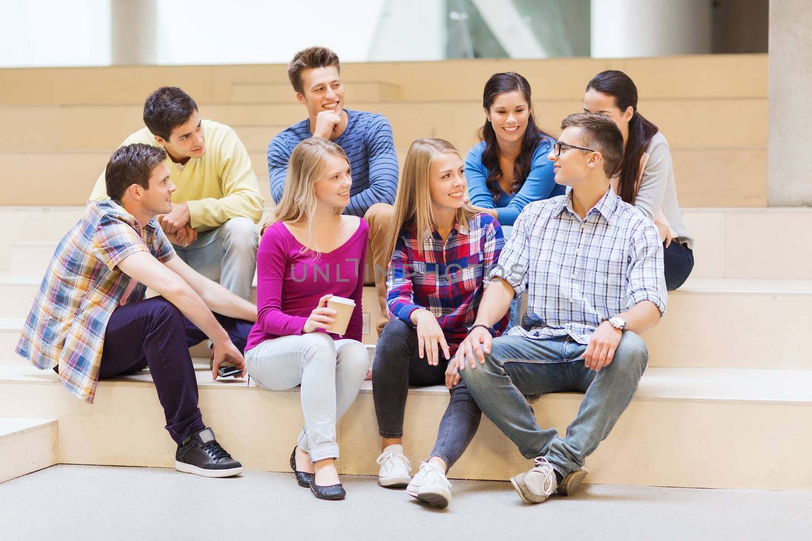 group of smiling students with paper coffee cups by dolgachov