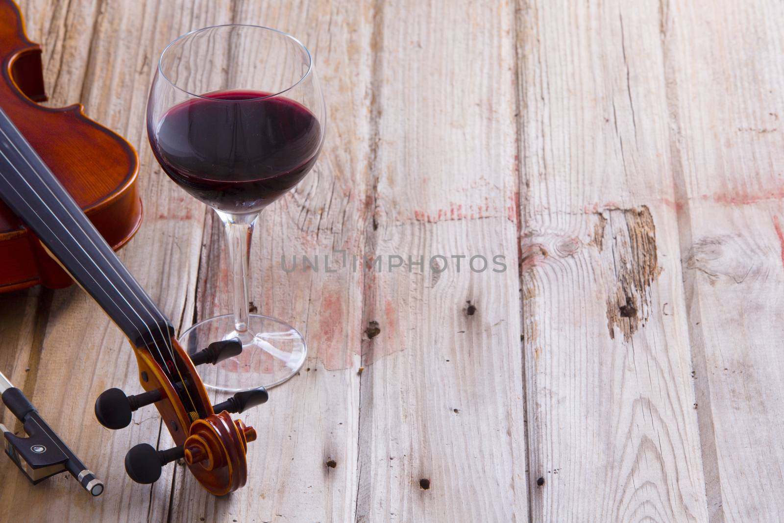 Violin and Wine on Wooden Floor with Copy Space by coskun