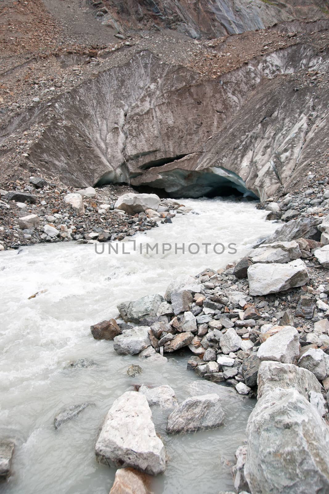 River stream from a glacier in mountain hiking attraction