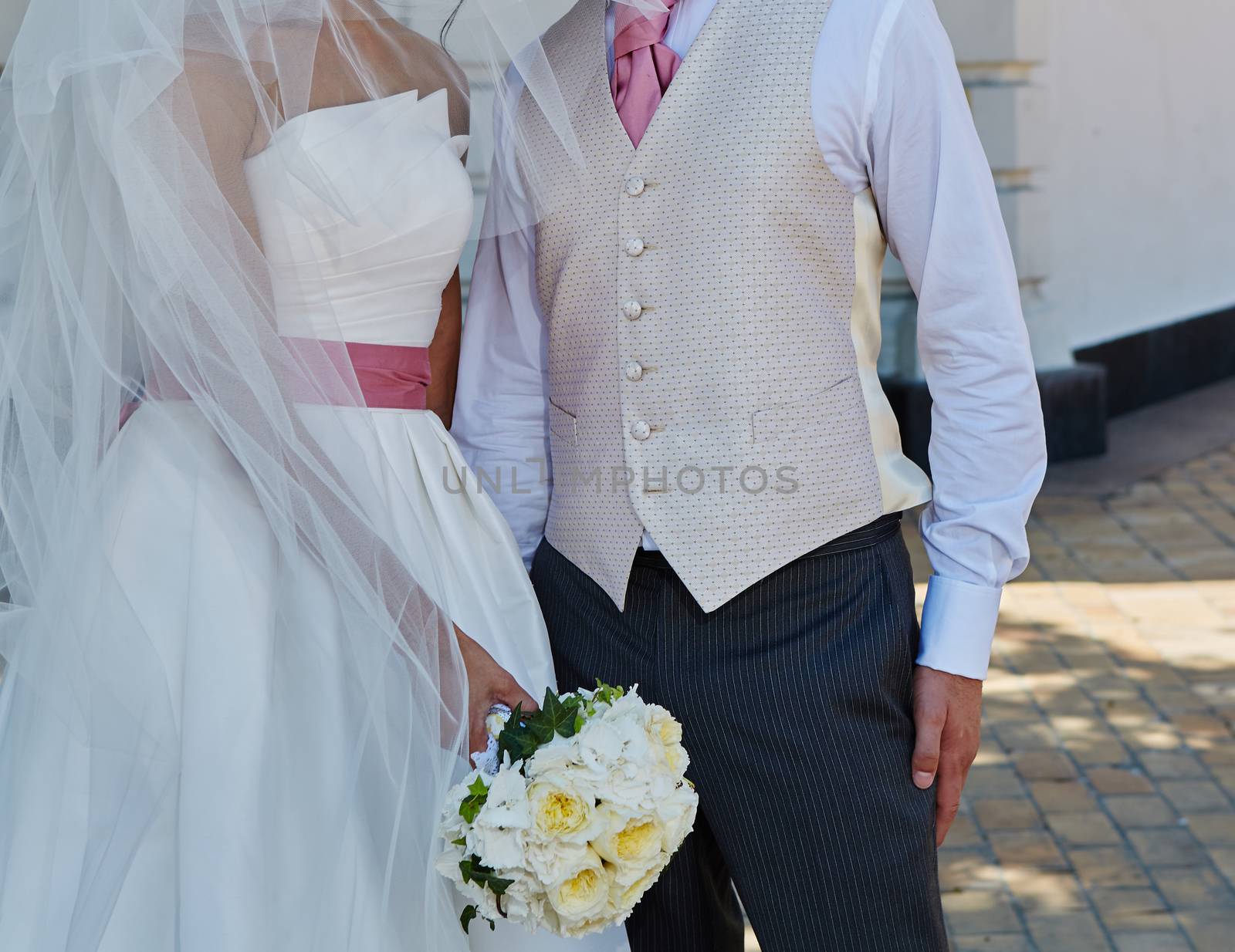 Elegant bride and groom posing together  by sarymsakov