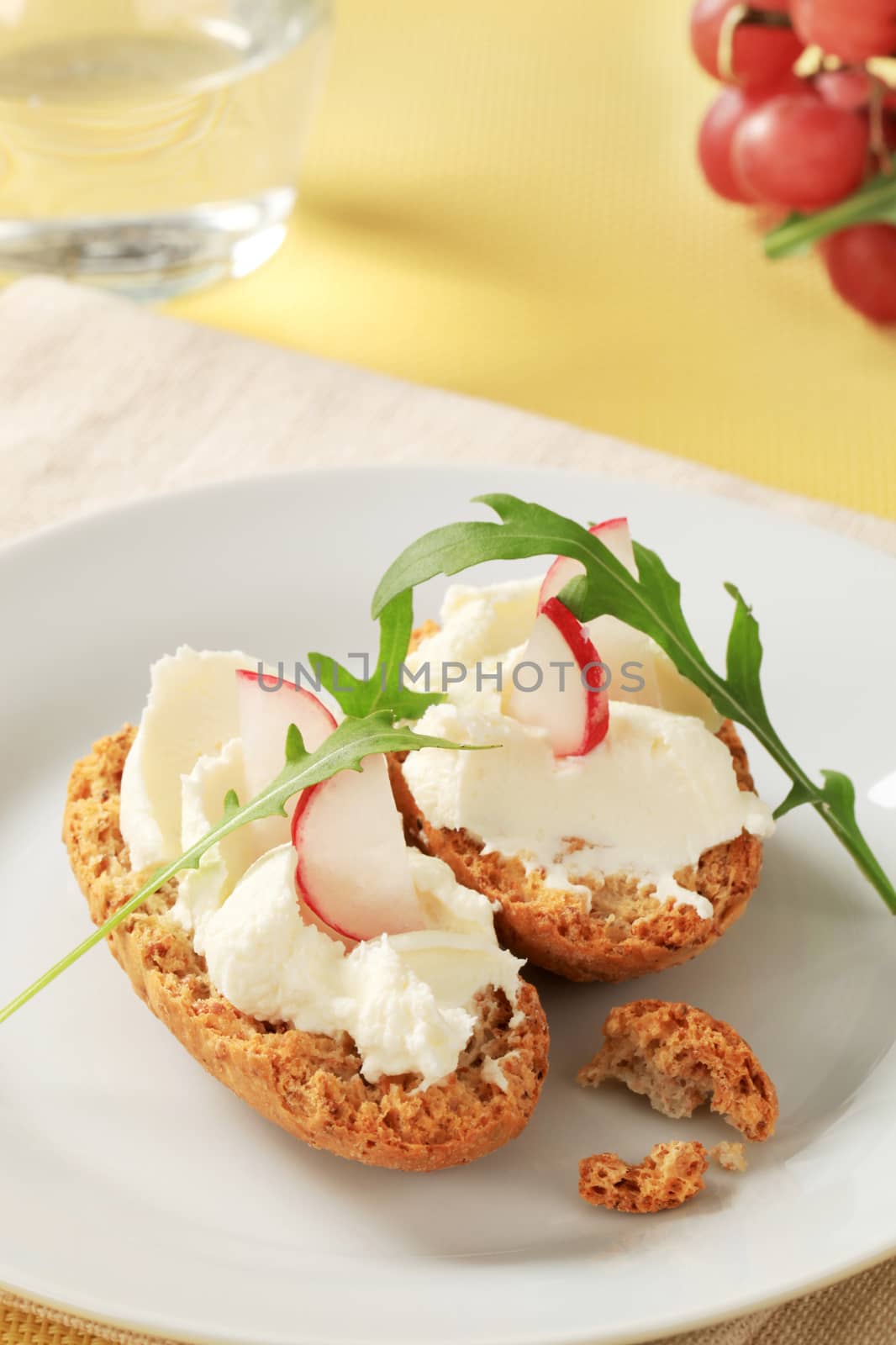 Crisp rolls with cheese spread and radish