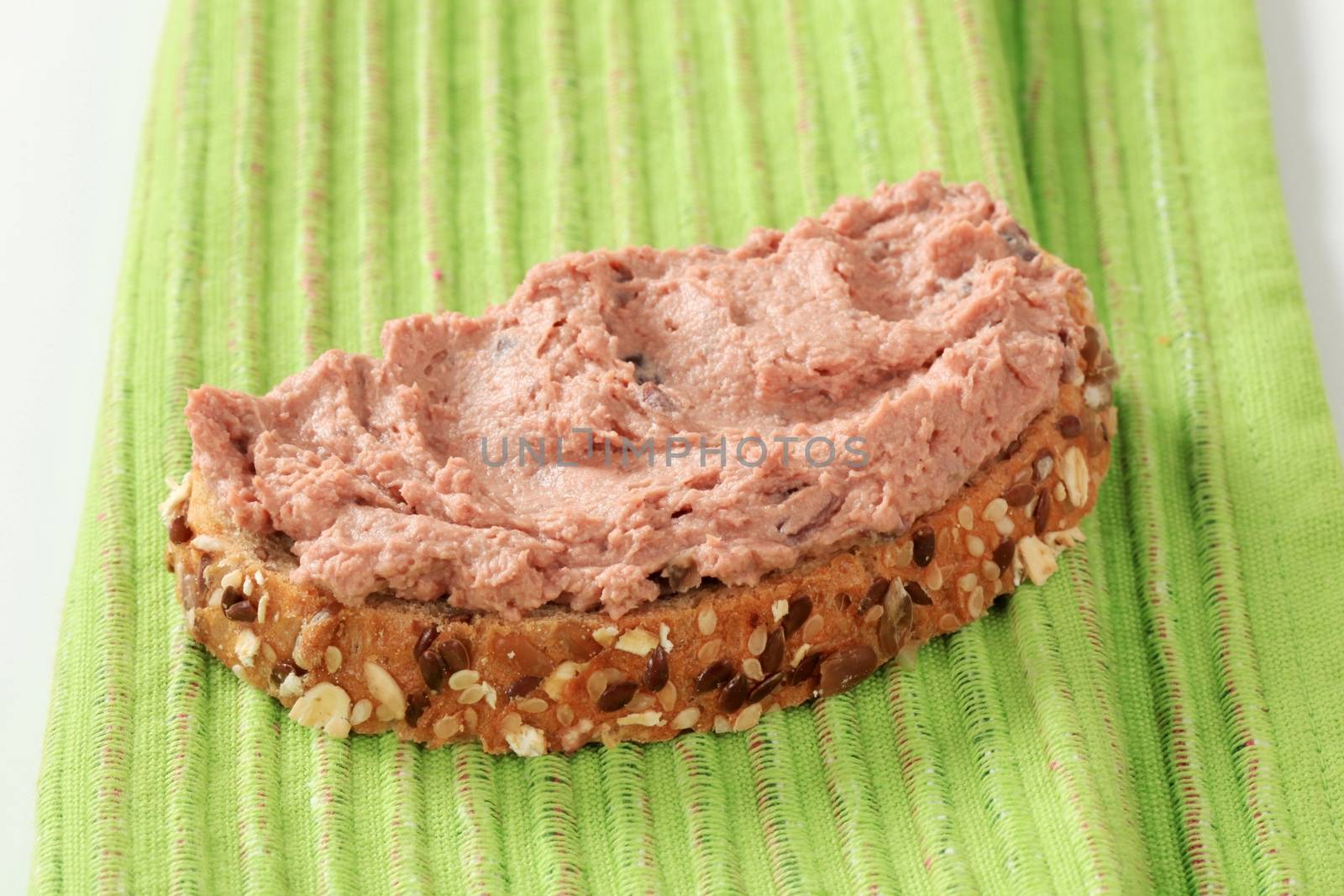 Slice of bread roll and liver pate