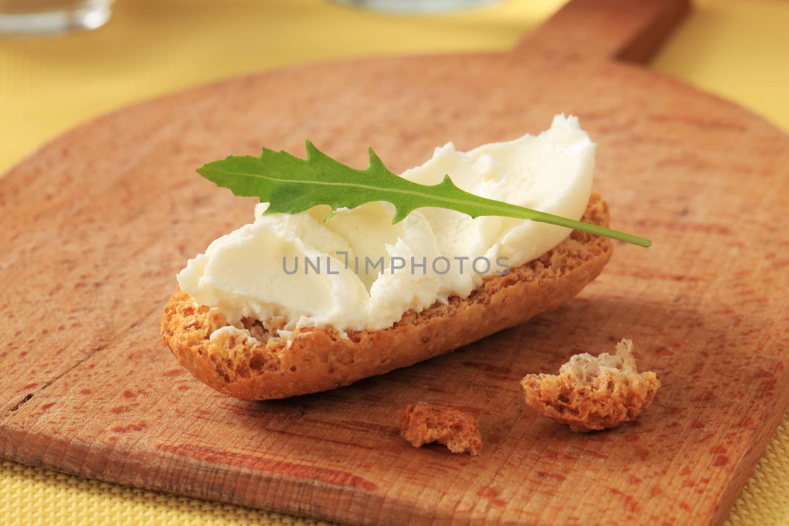 Crispy roll and cheese spread - closeup