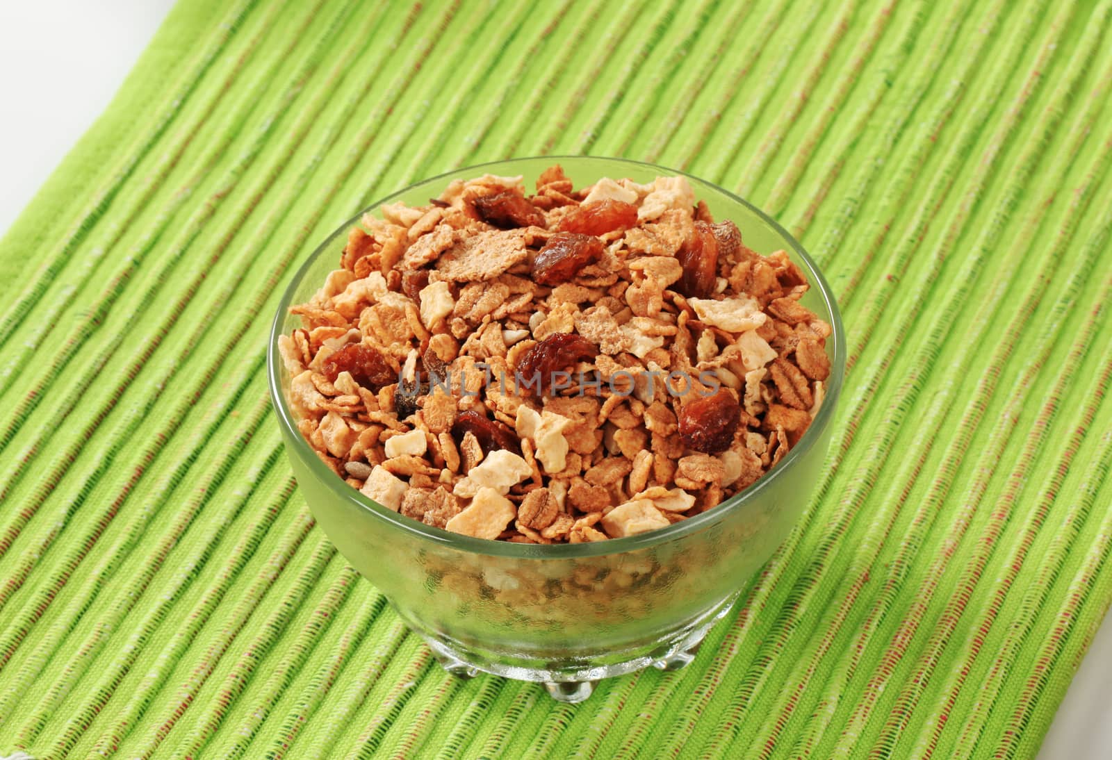 Bowl of mixed breakfast cereals and dried fruit