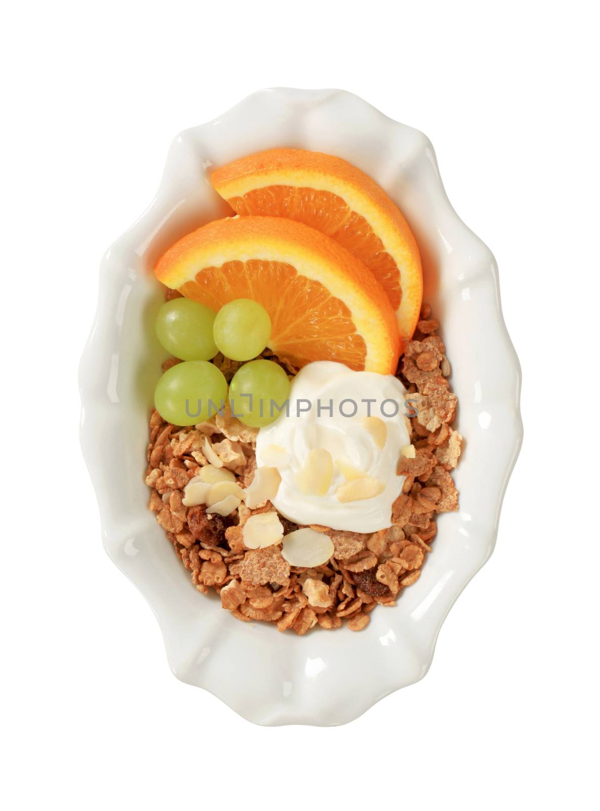 Bowl of breakfast cereals with fresh fruit and quark