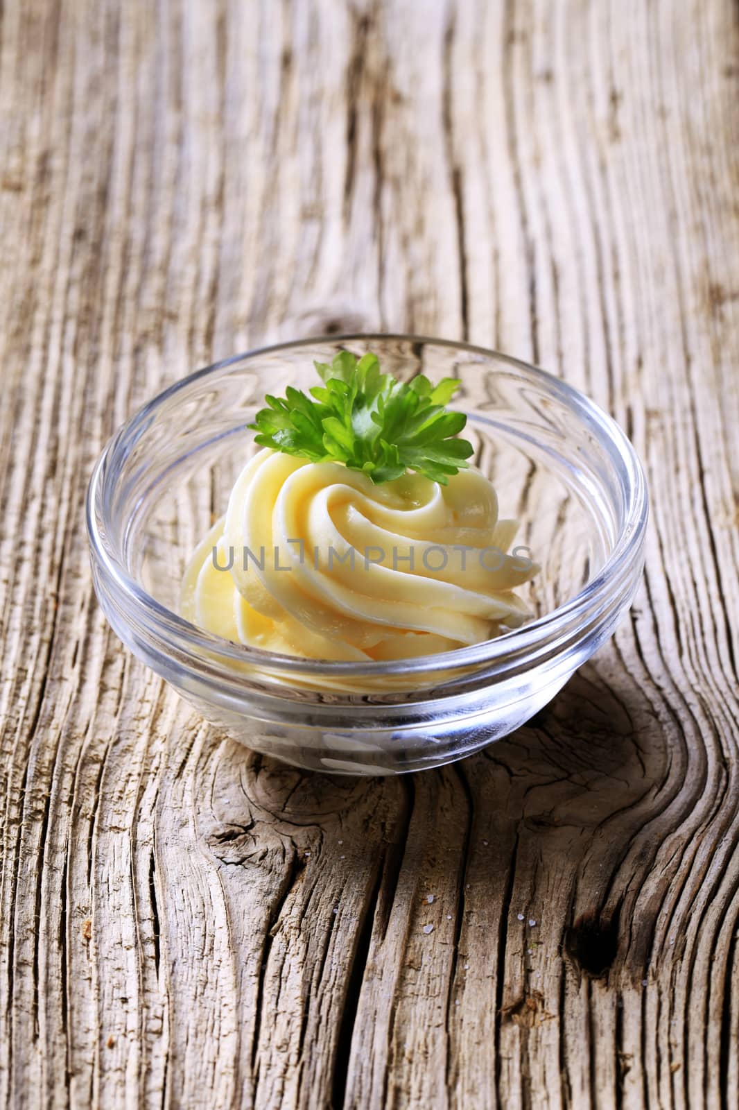 Swirl of fresh butter in a glass dish