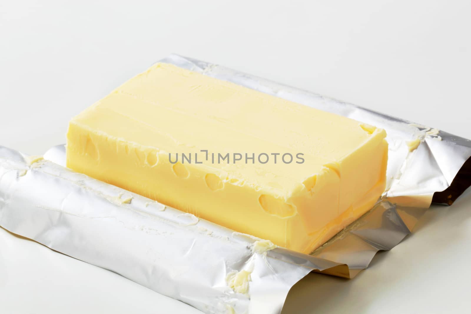 Block of fresh butter resting on a wrapper