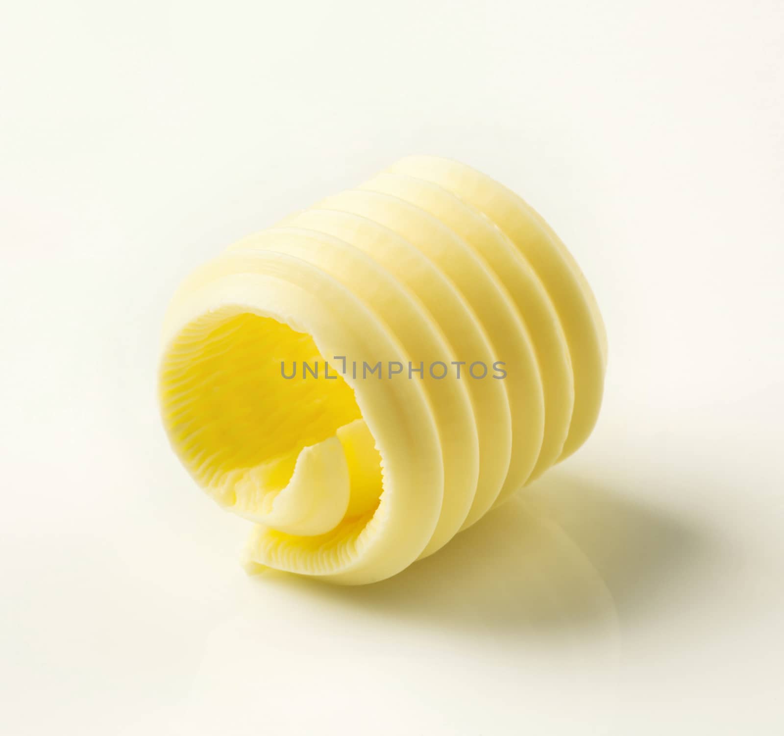 Studio shot of a curl of fresh butter 
