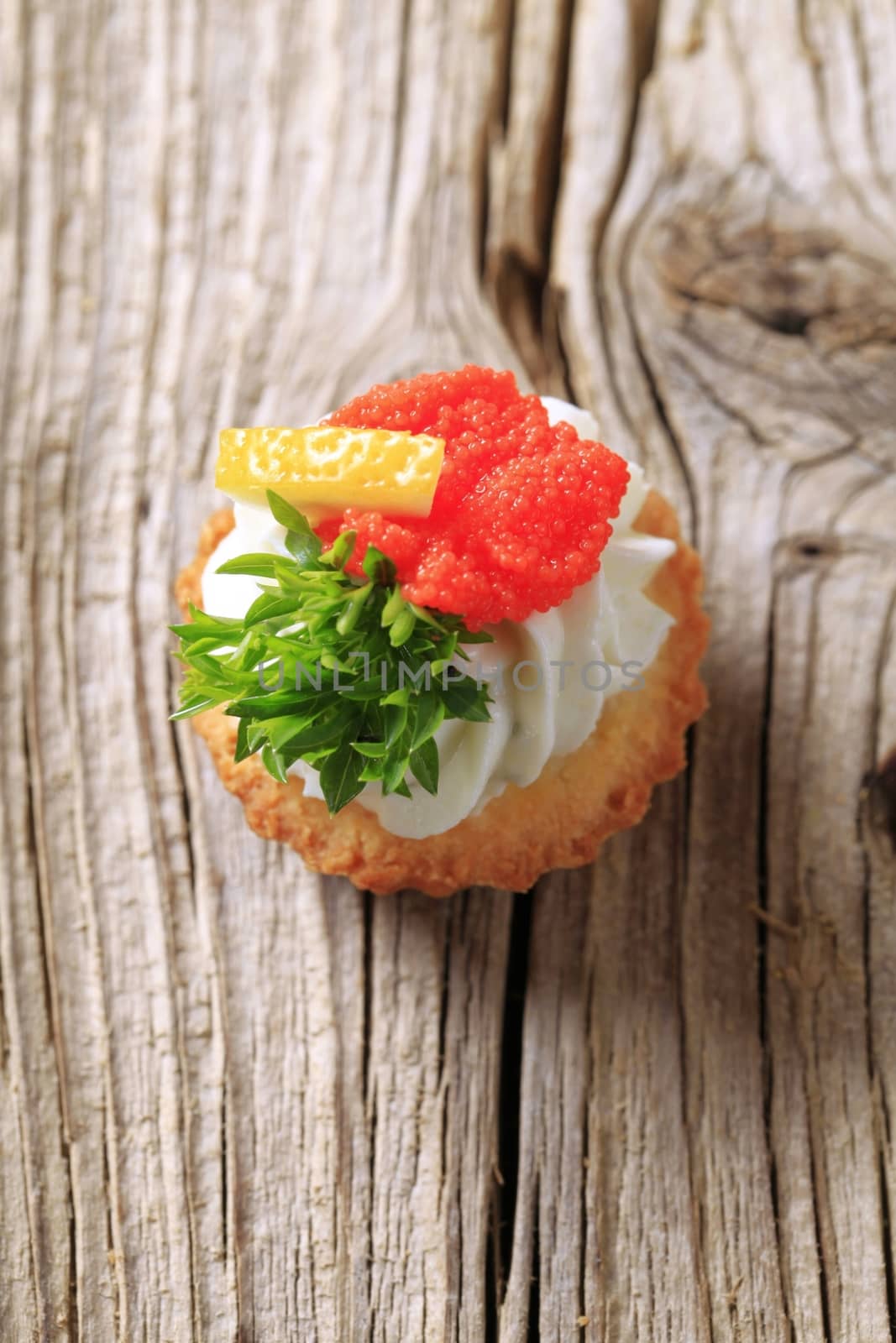 Tart pastry with savory spread topping - detail