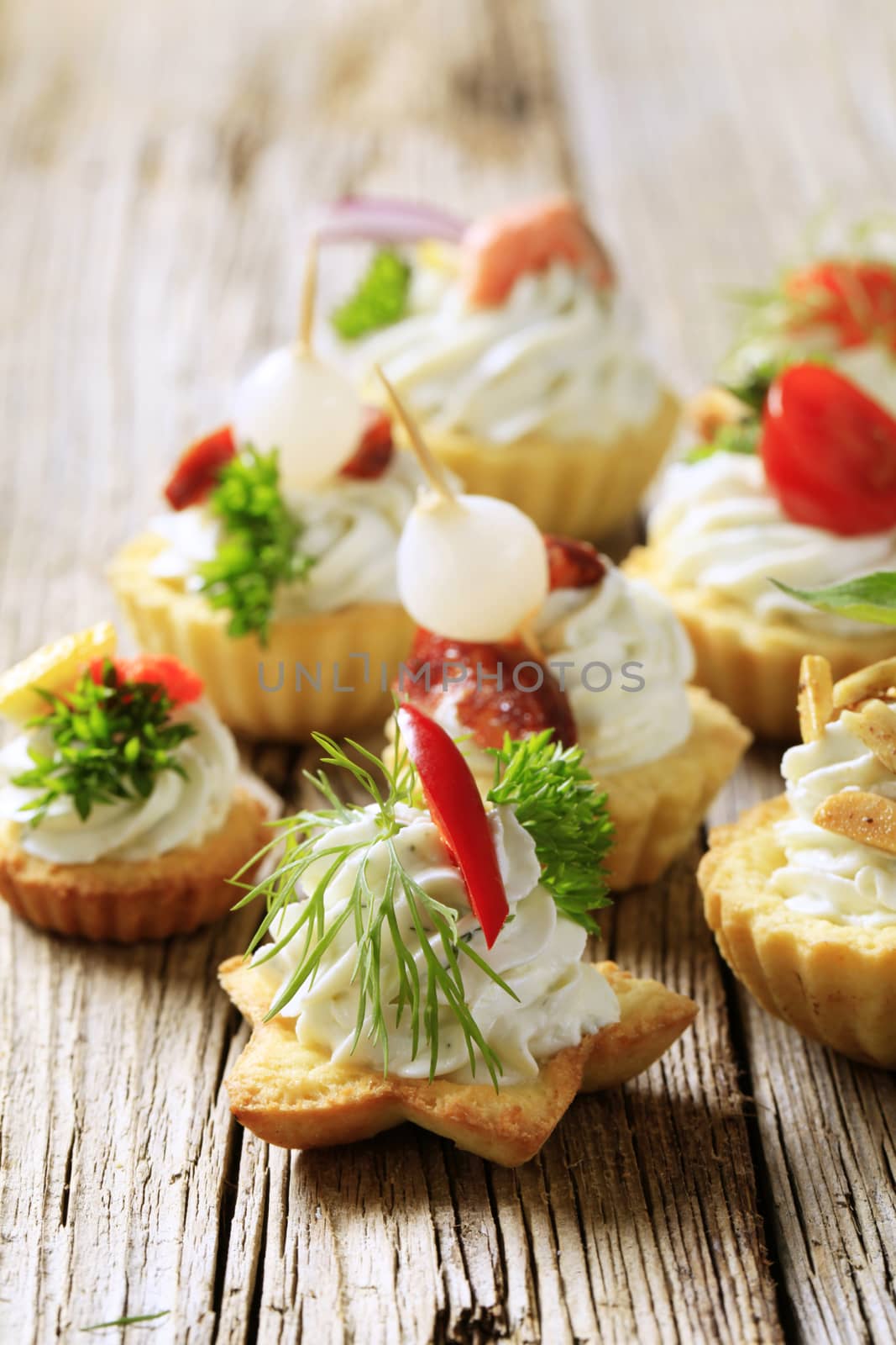 Variety of pastry-based canapes with various toppings