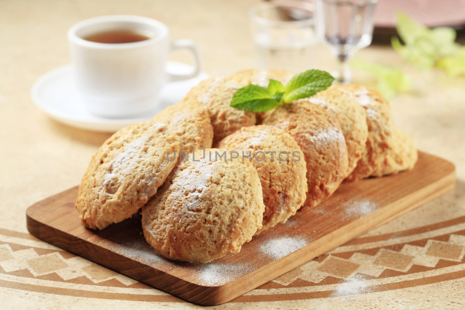 Rows of crispy cookies on a cutting board