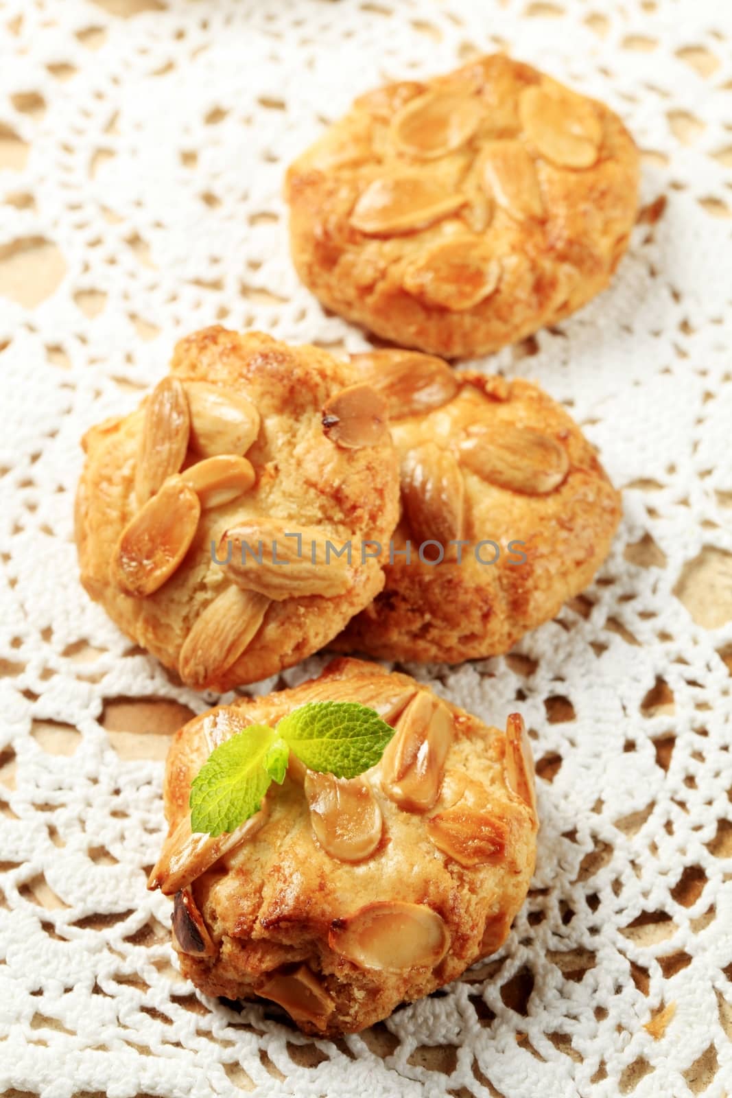 Almond cookies on a white crocheted doily