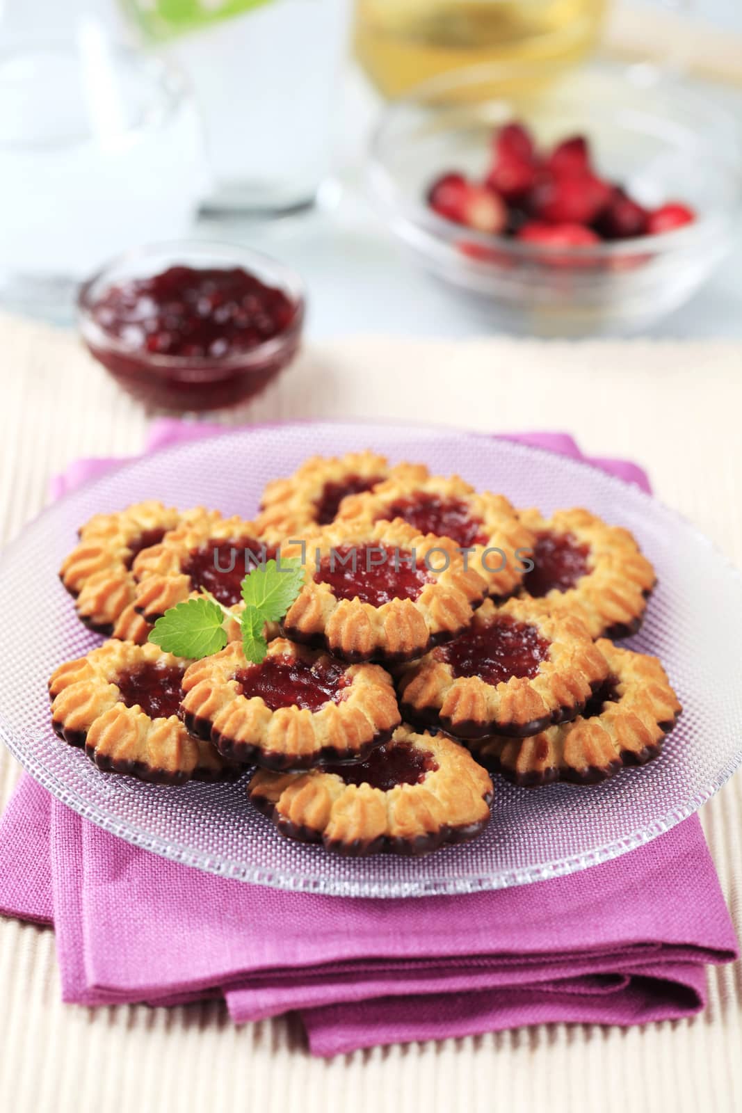 Chocolate dipped butter cookies with jam centers