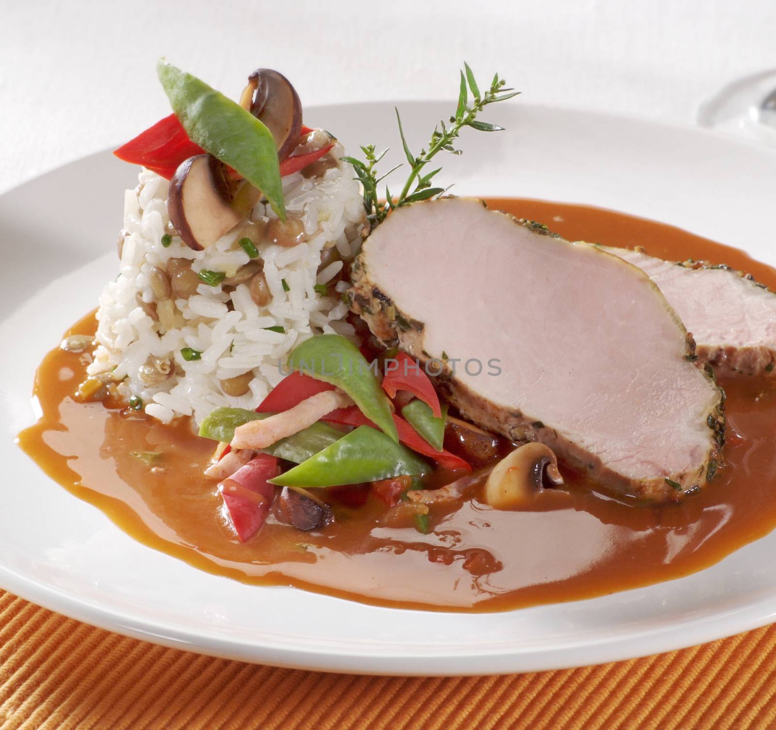 Roast pork loin with rice and sauce