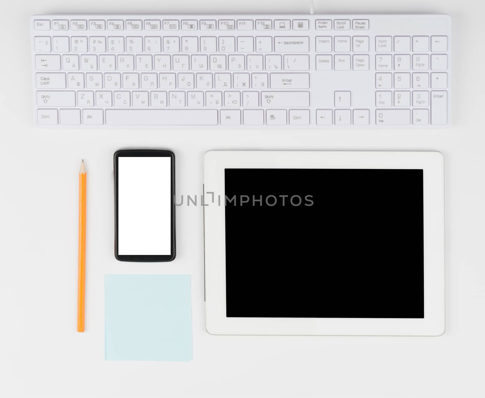Keyboard with tablet and smartphone on isolated white background