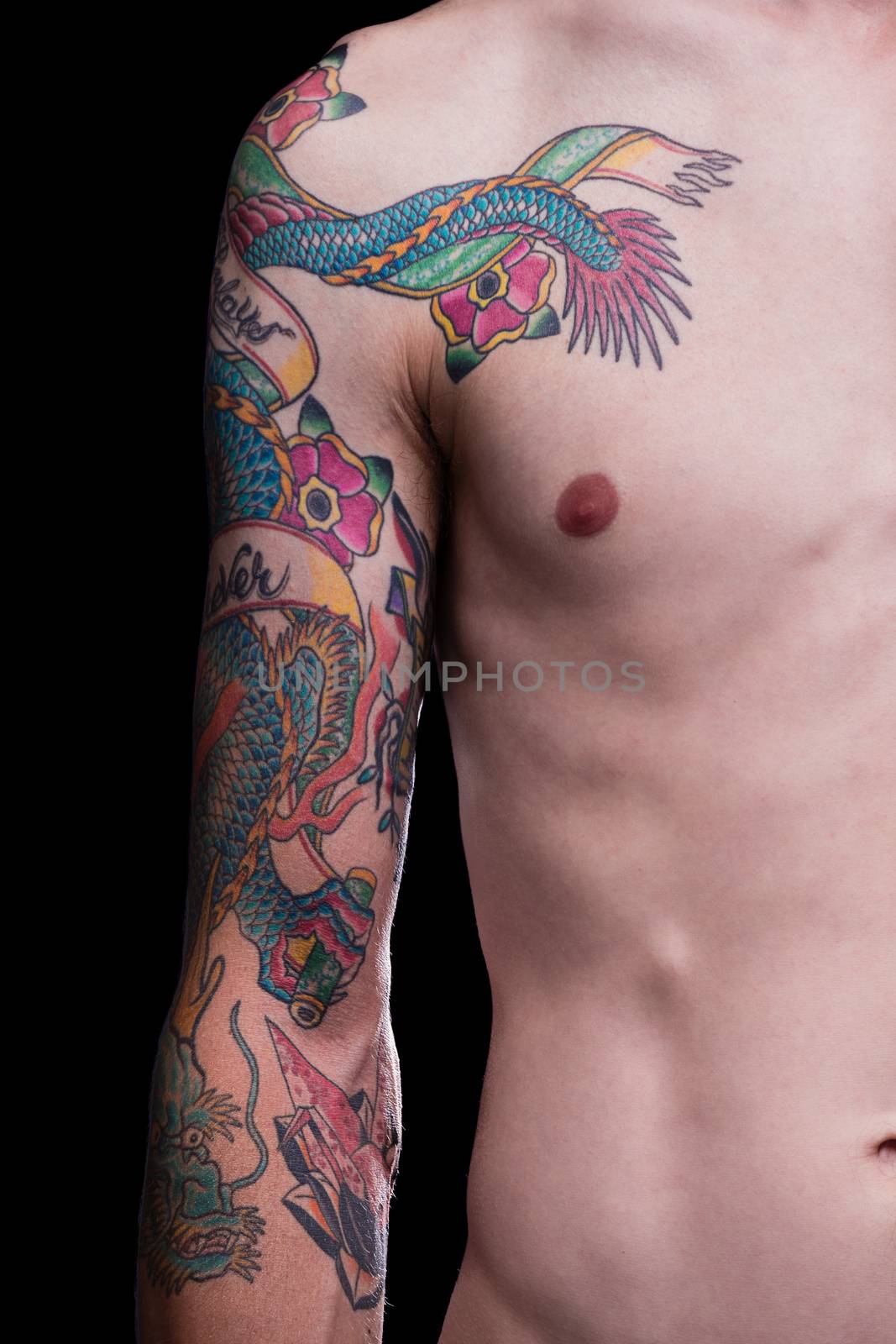 A man with a 3/4 sleeve of Japanese style tattoos including a dragon, origami crane and flowers.