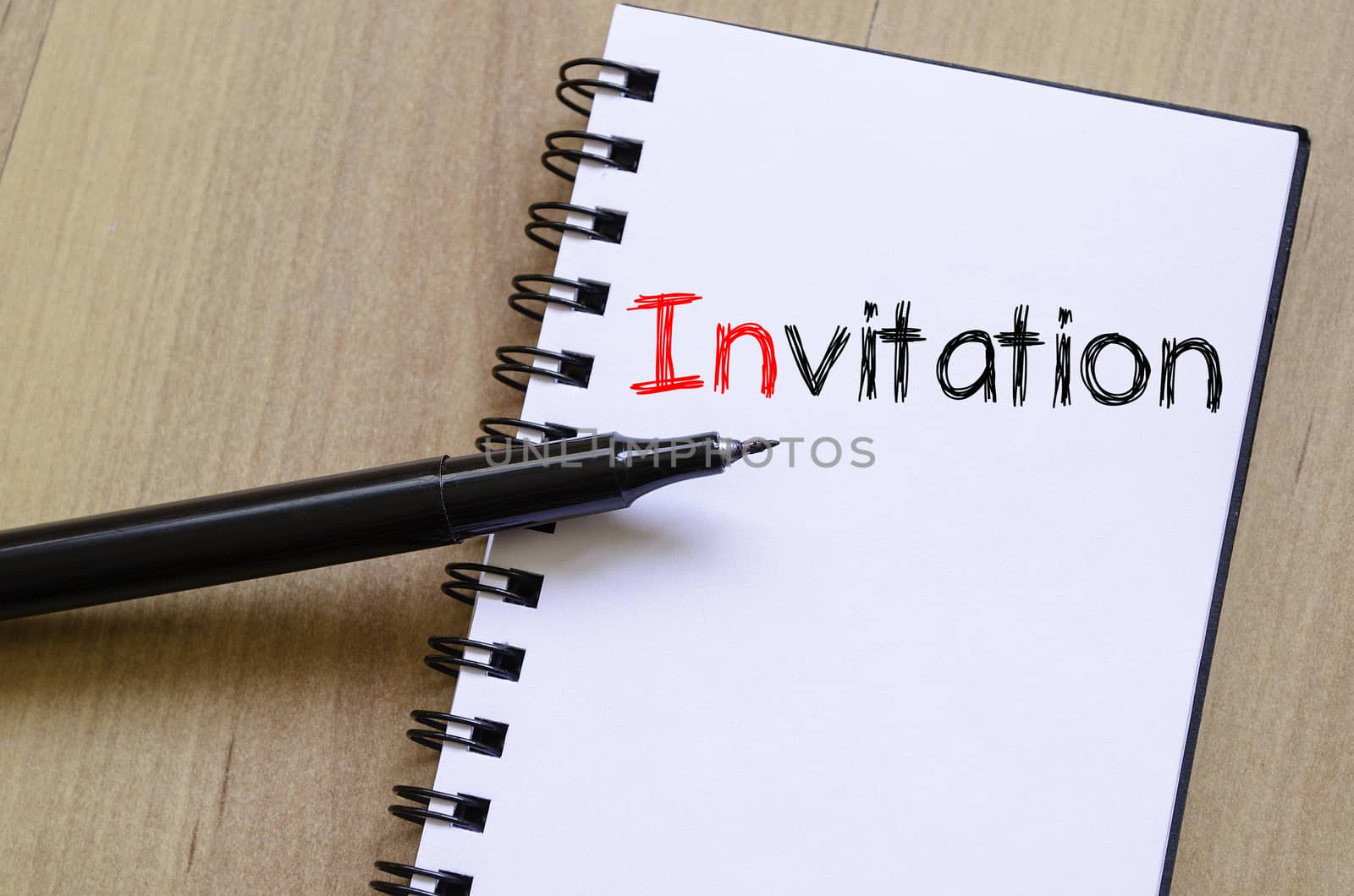 Invitation text concept write on notebook