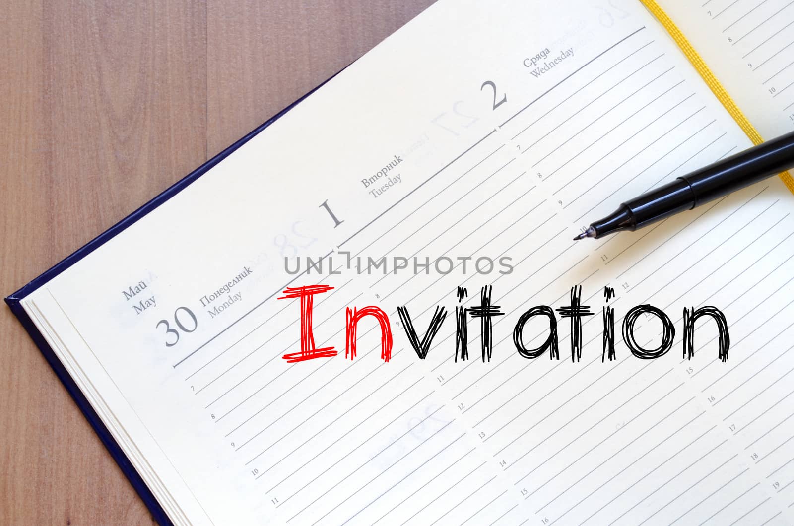 Invitation text concept write on notebook
