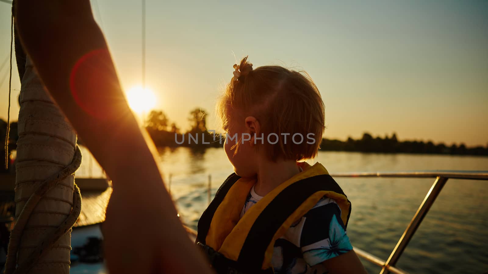 Little girl enjoying ride on yacht by sarymsakov