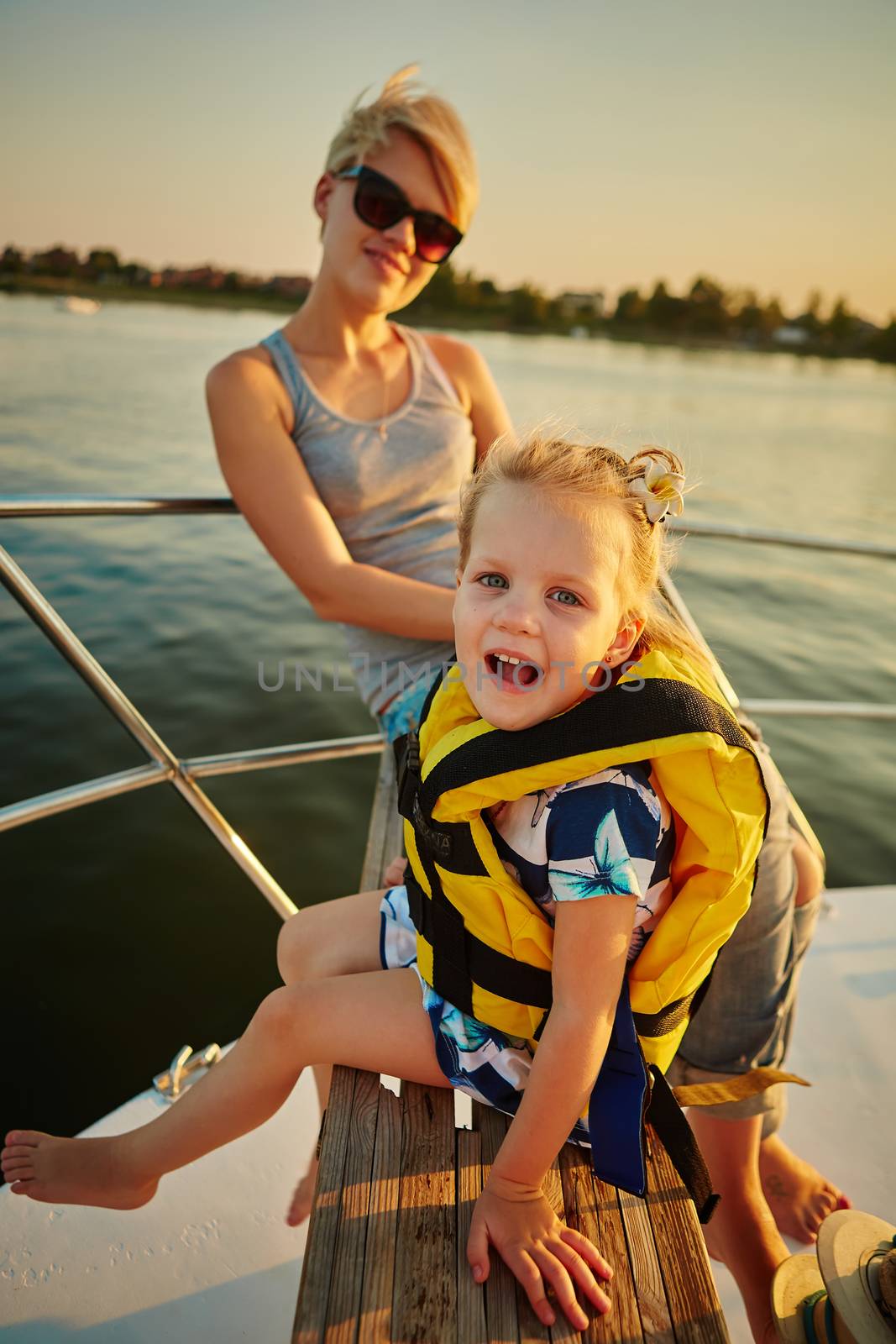 Mother, daughter on yacht.  Concept of the family by sarymsakov