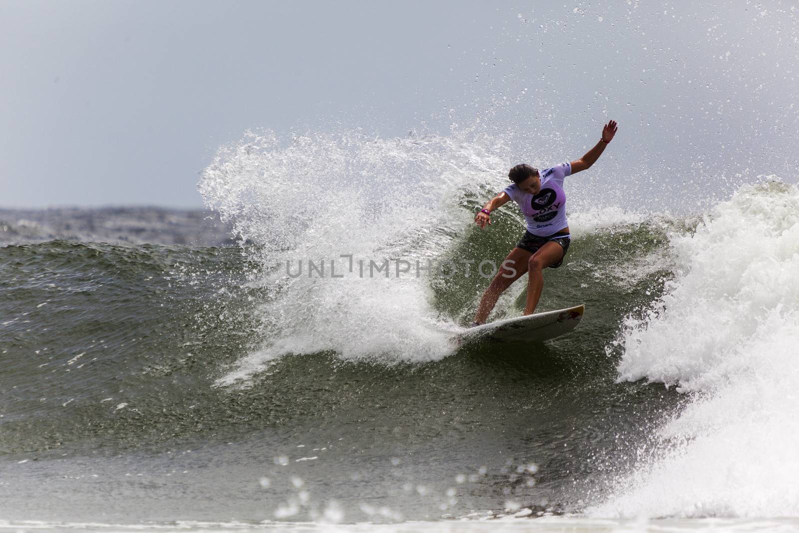 SNAPPER ROCKS, GOLD COAST, AUSTRALIA - 9 MARCH: Unidentified Surfer races the Quicksilver & Roxy Pro World Title Event. 9 March 2013, Snapper Rocks, Gold Coast, Australia