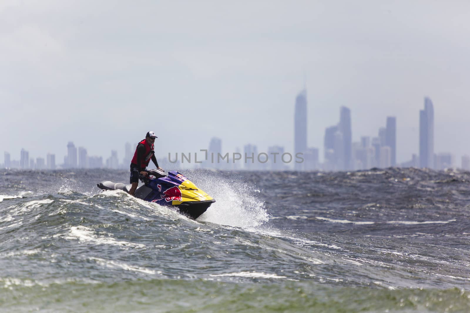 Surfer races the Quicksilver & Roxy Pro World Title Event by Imagecom