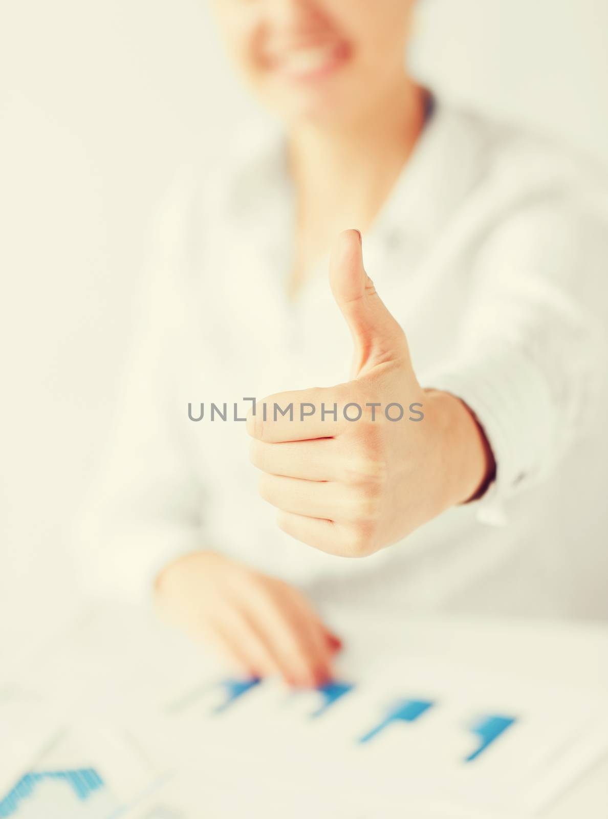 business, office, school and education concept - happy woman with charts, papers and thumbs up