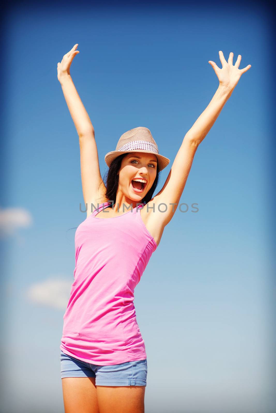 girl with hands up on the beach by dolgachov