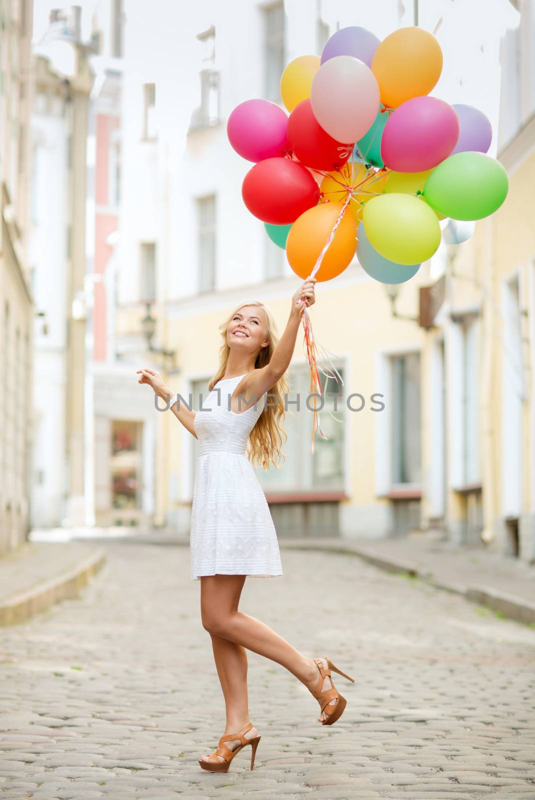 woman with colorful balloons by dolgachov