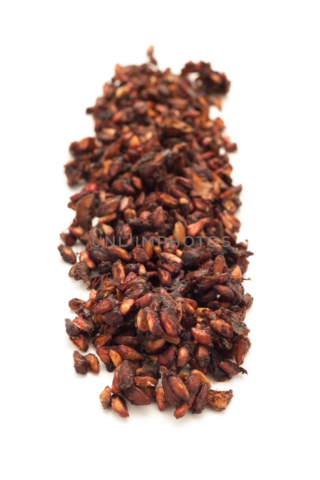 Row of Organic Dried Pomegranate (Punica granatum) isolated on white background.