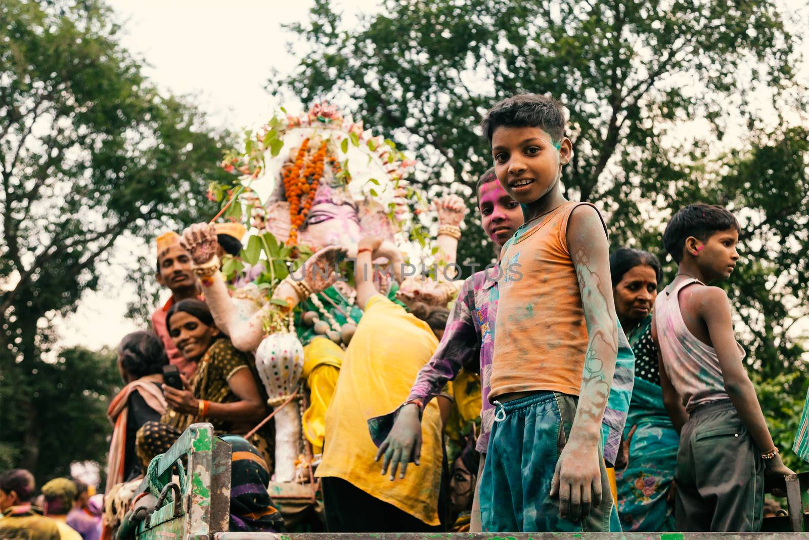 People carrying Hindu God Idol Ganesh for Holy Immersion (Ganpati Visharjan) at The Ganges River, 27 Sep 2015, Kanpur, INDIA.