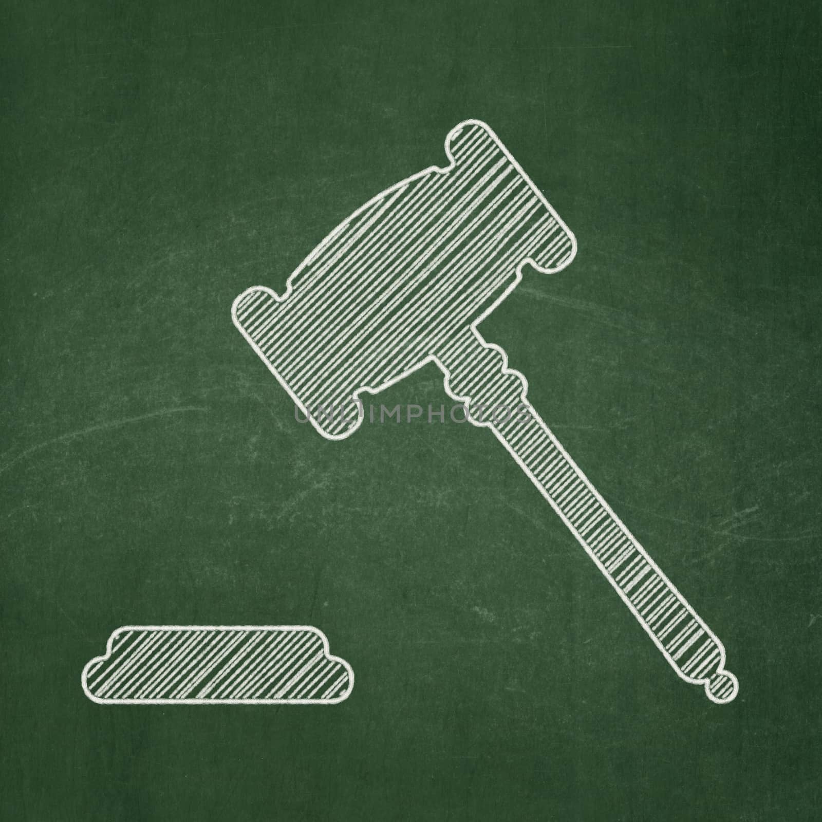 Law concept: Gavel on chalkboard background by maxkabakov