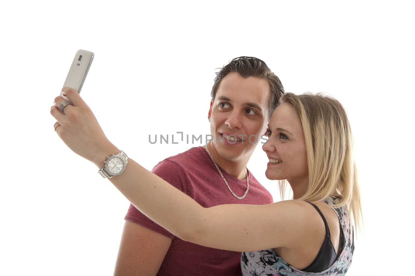 Young couple making selfie over white background