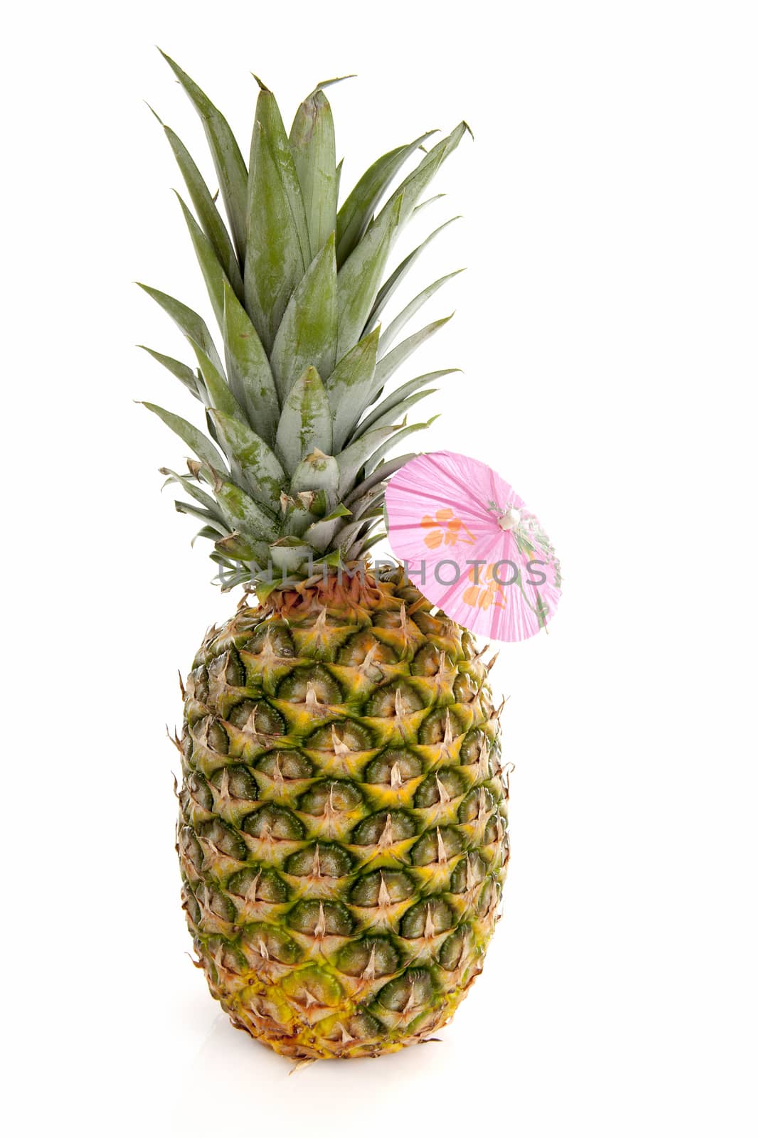 Tropical pineapple with pink umbrella over white background