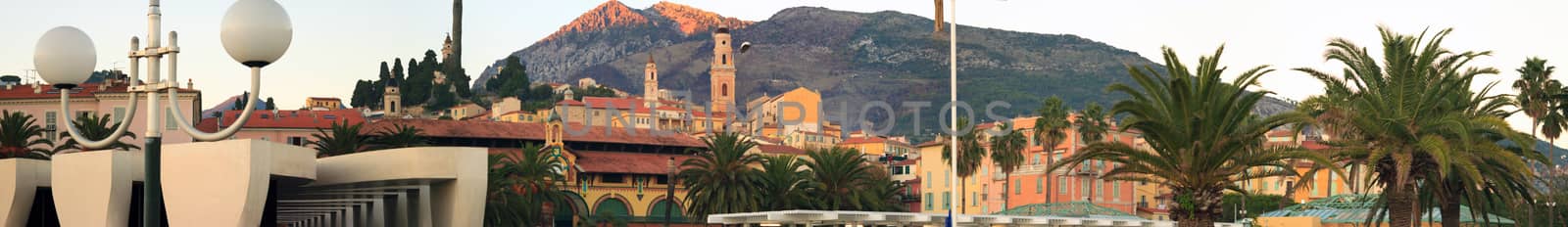 Beautiful Sunset on the beach and the town of Menton, French Riviera