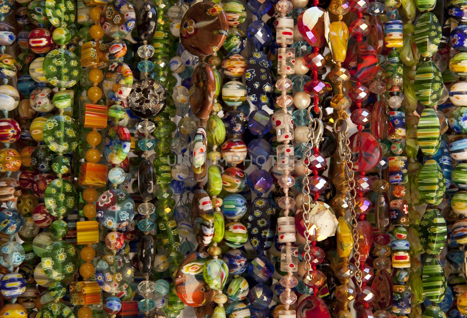 A large number of beads of different colors and shapes for sale.