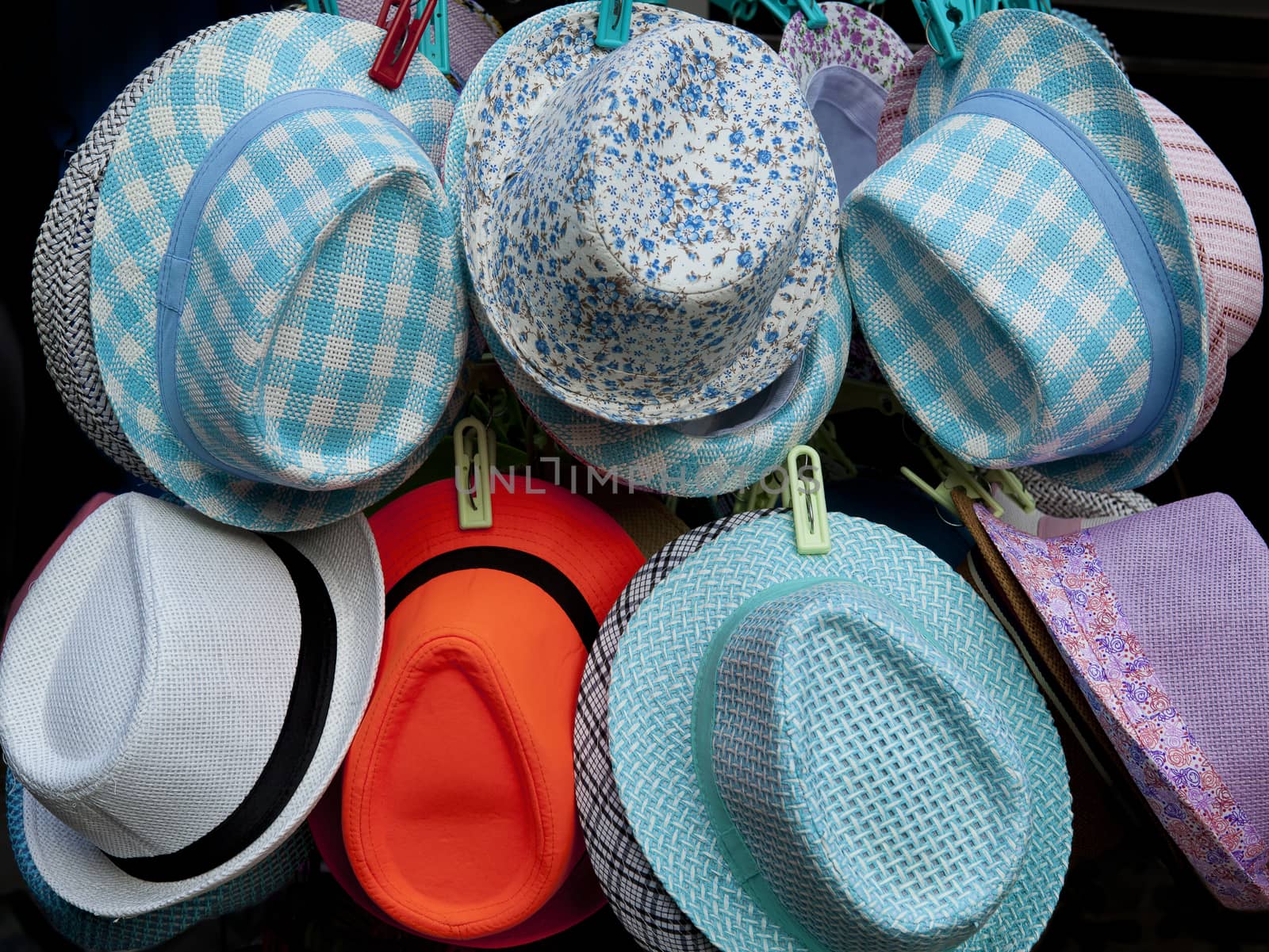 Multi-colored hats are sold in the market for beauty.