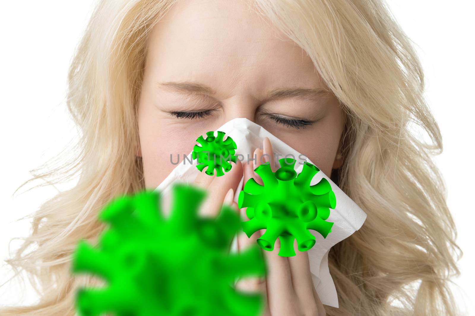 Portrait of a ill blond woman who is sneezing virus in a tissue