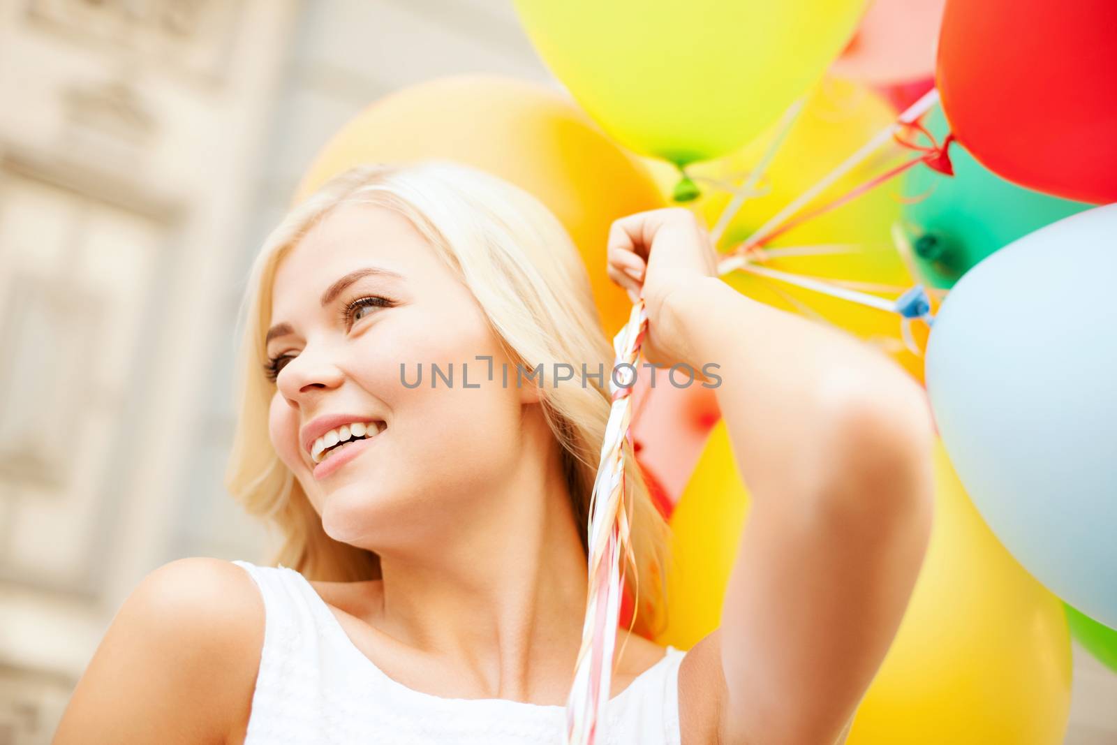 woman with colorful balloons by dolgachov