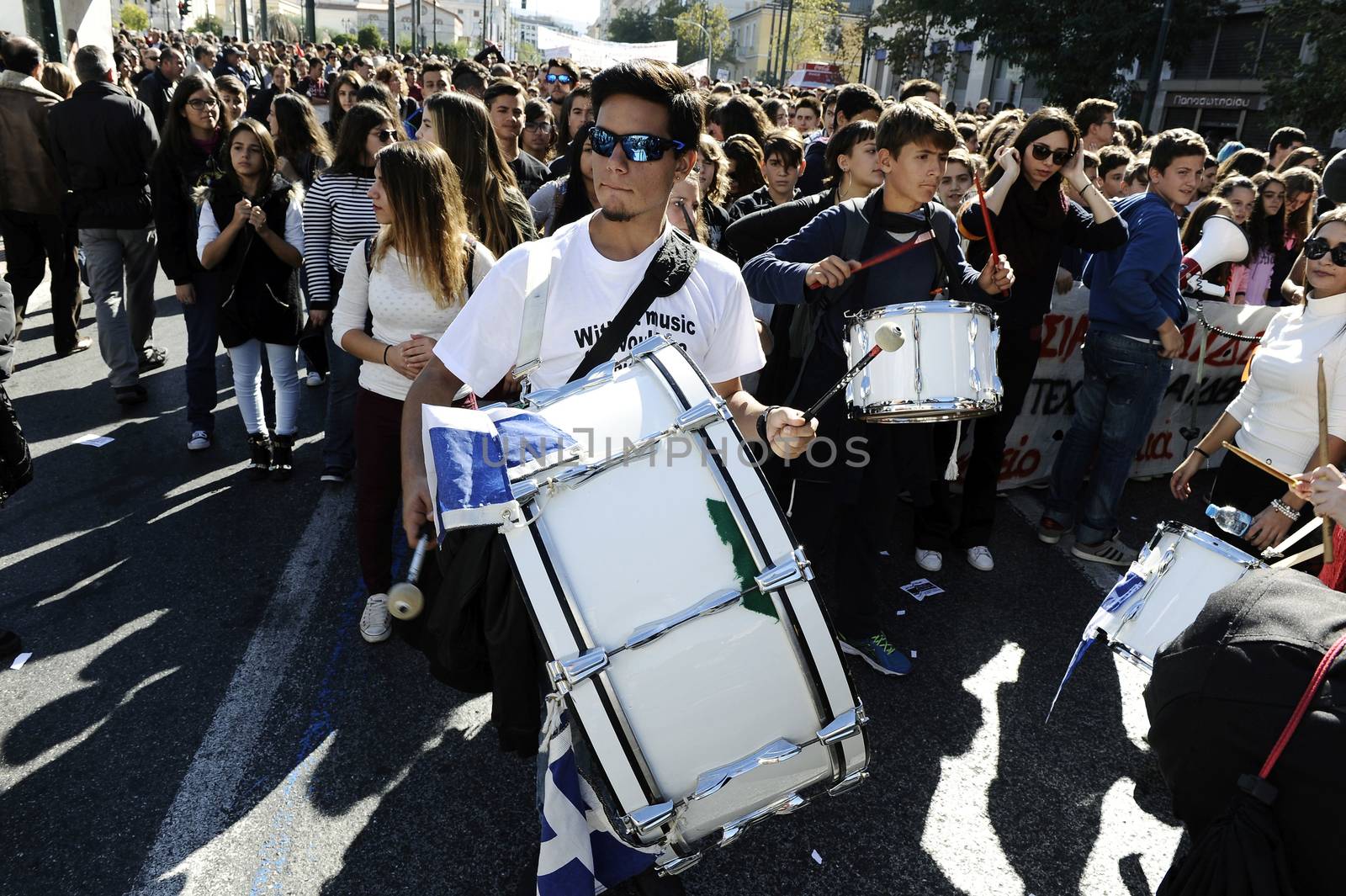 GREECE, Athens: Thousands of student-protesters fill the streets of Athens, Greece on November 2, 2015. The young demonstrators yell chants and carry signs as they rally against cuts to education and a shortage of teachers, amid ongoing protests against austerity in Greece. Reports from local media indicate that a contingent had broken off from the larger protest, vandalizing a cell phone store, and trying to damage a bank on Othonos, a street in Athens.