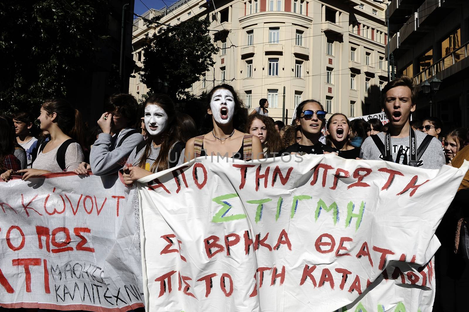 GREECE, Athens: Thousands of student-protesters fill the streets of Athens, Greece on November 2, 2015. The young demonstrators yell chants and carry signs as they rally against cuts to education and a shortage of teachers, amid ongoing protests against austerity in Greece. Reports from local media indicate that a contingent had broken off from the larger protest, vandalizing a cell phone store, and trying to damage a bank on Othonos, a street in Athens.