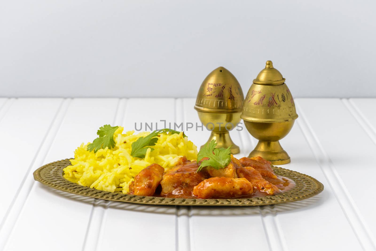 Dish if spicy chicken vindaloo served with basmati rice.