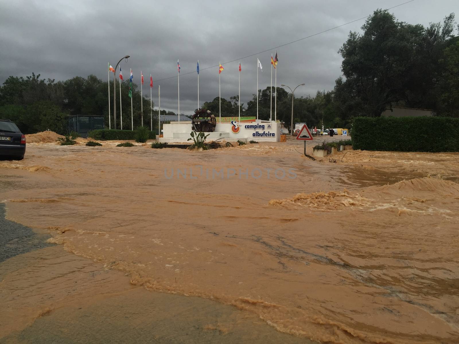 PORTUGAL, Albufeira: The streets of Albufeira, Portugal are completely flooded on November 1, 2015 following heavy rainfall that left at least one person dead and several others homeless in the southern part of the country. The one death reported thus far was of a 79-year-old man, who had intended to go shopping in Boliqueime when his car was overcome by rising water.