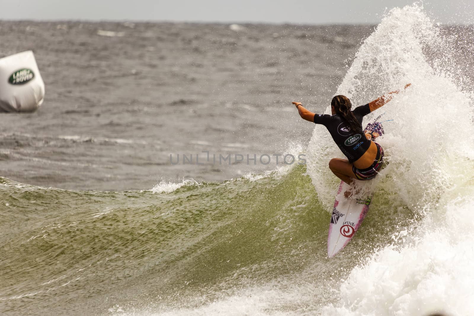 SNAPPER ROCKS, GOLD COAST, AUSTRALIA - 9 MARCH: Unidentified Surfer races the Quiksilver & Roxy Pro World Title Event. 9 March 2013, Snapper Rocks, Gold Coast, Australia