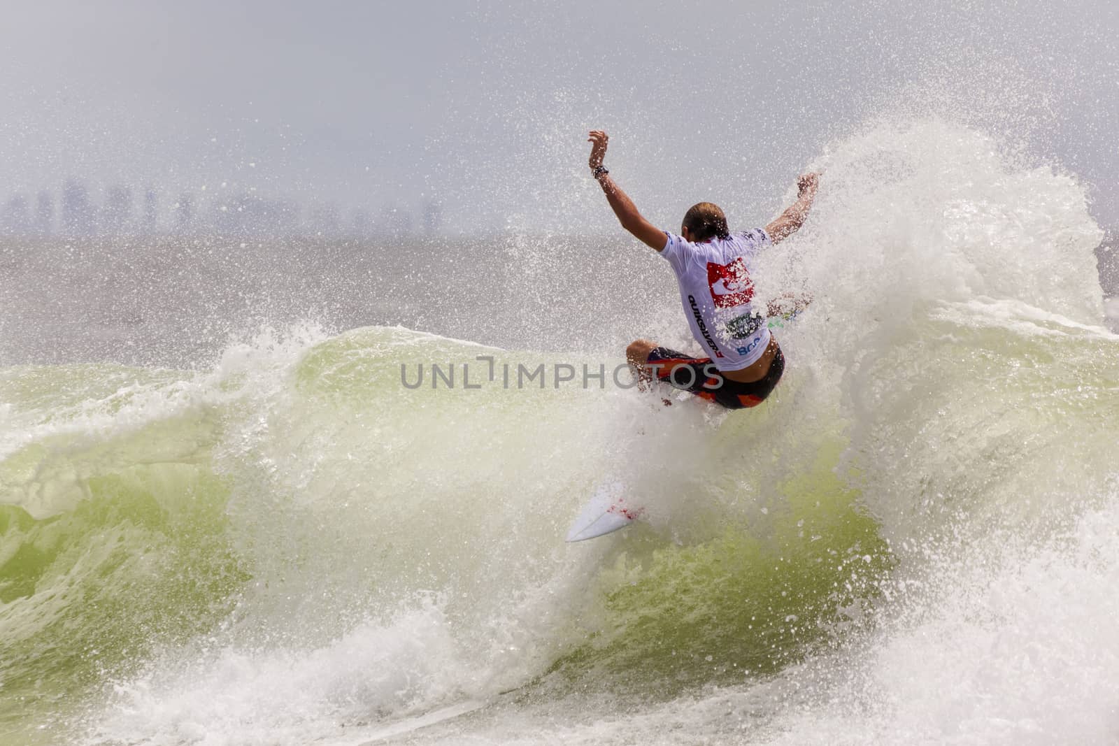 SNAPPER ROCKS, GOLD COAST, AUSTRALIA - 9 MARCH: Unidentified Surfer races the Quiksilver & Roxy Pro World Title Event. 9 March 2013, Snapper Rocks, Gold Coast, Australia