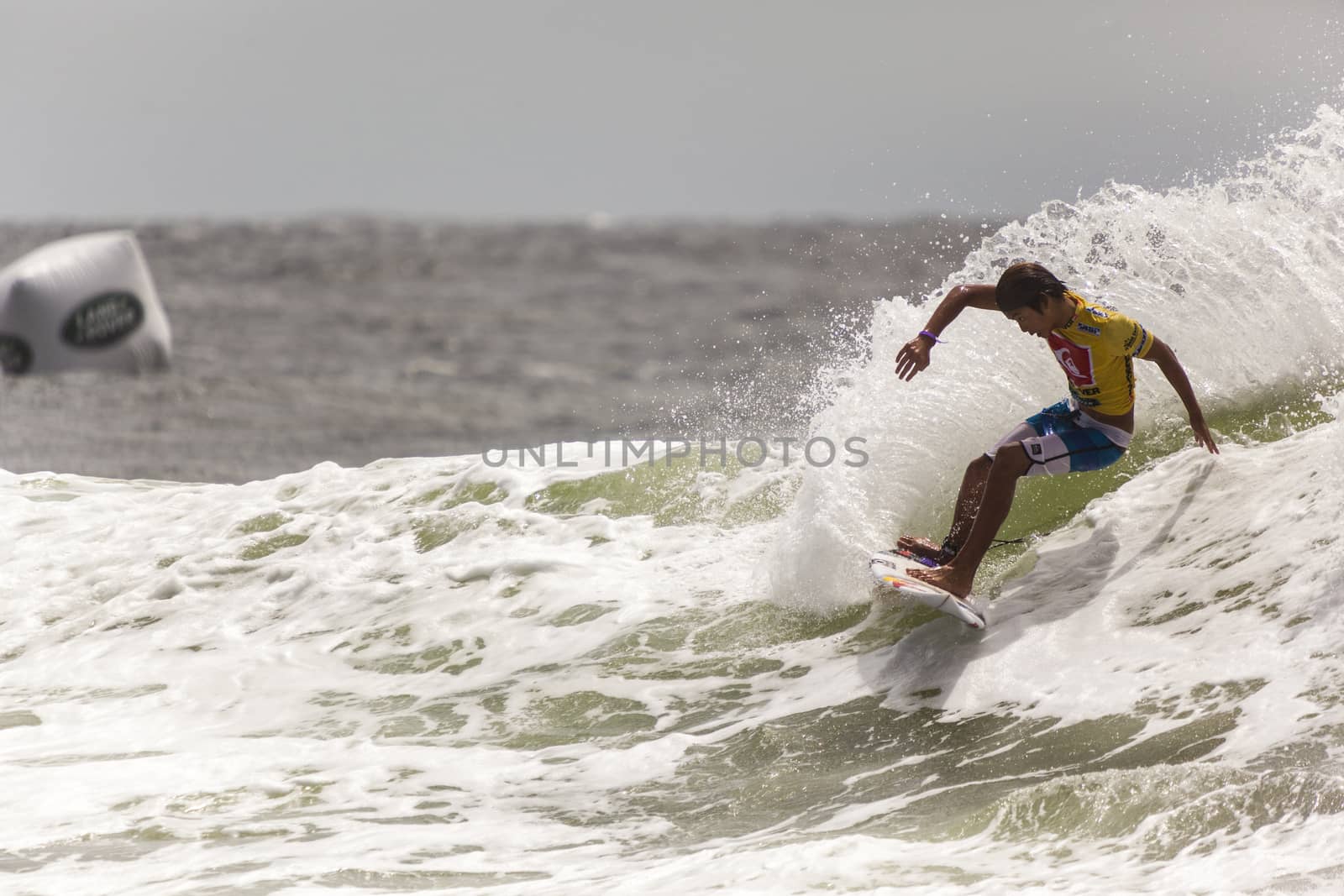 SNAPPER ROCKS, GOLD COAST, AUSTRALIA - 9 MARCH: Unidentified Surfer races the Quiksilver & Roxy Pro World Title Event. 9 March 2013, Snapper Rocks, Gold Coast, Australia