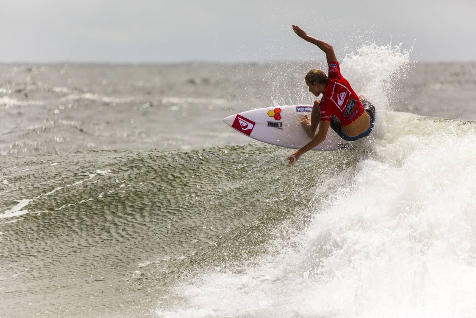 SNAPPER ROCKS, GOLD COAST, AUSTRALIA - 9 MARCH: Unidentified Surfer races the Quiksilver & Roxy Pro World Title Event. 9 March 2013, Snapper Rocks, Gold Coast, Australia