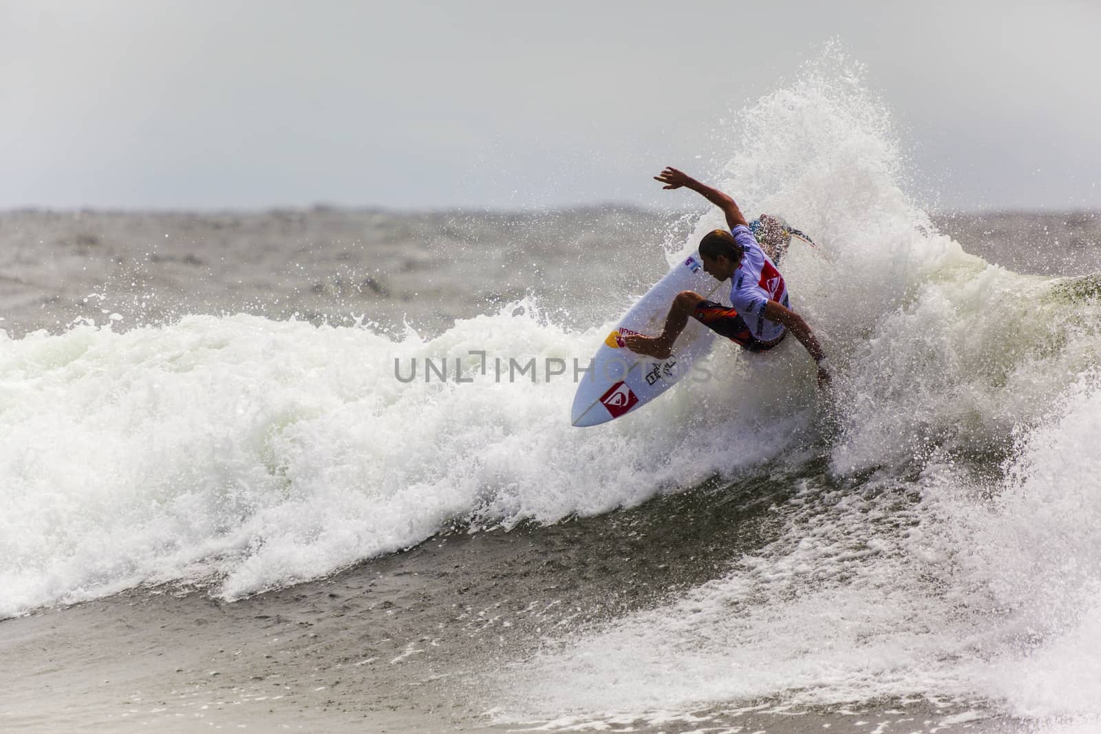 SNAPPER ROCKS, GOLD COAST, AUSTRALIA - 9 MARCH: Unidentified Surfer races the Quiksilver & Roxy Pro World Title Event. 9 March 2013, Snapper Rocks, Gold Coast, Australia