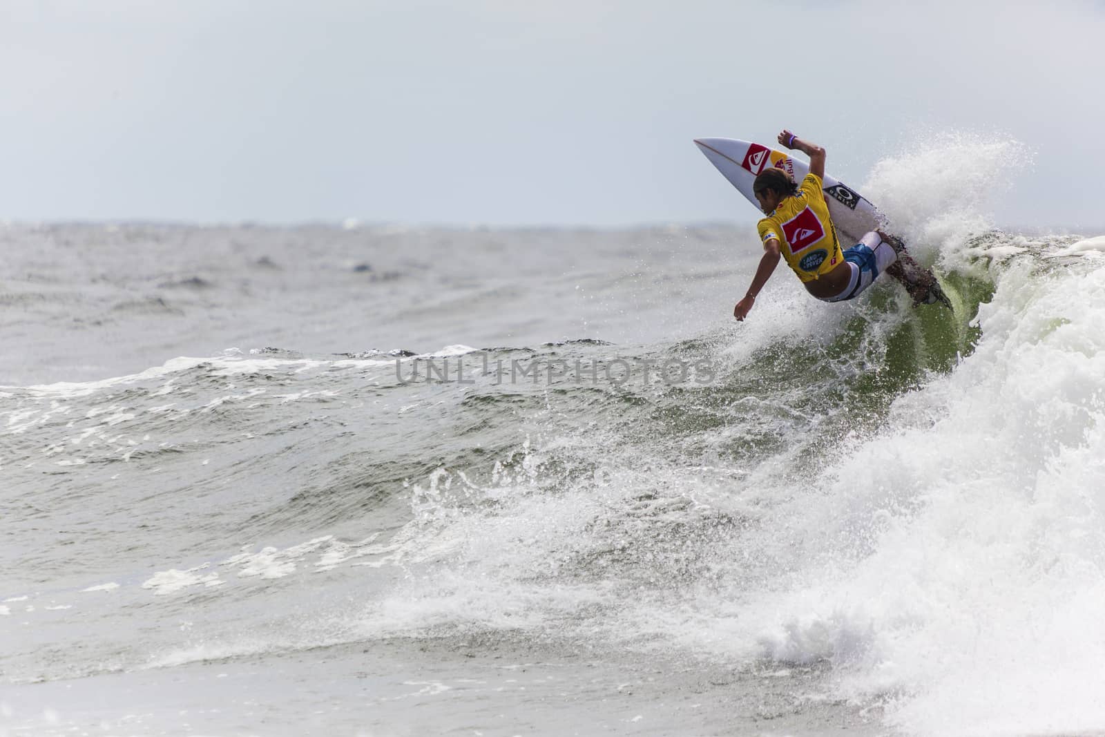 SNAPPER ROCKS, GOLD COAST, AUSTRALIA - 9 MARCH: Unidentified Surfer races the Quiksilver & Roxy Pro World Title Event. 9 March 2013, Snapper Rocks, Gold Coast, Australia